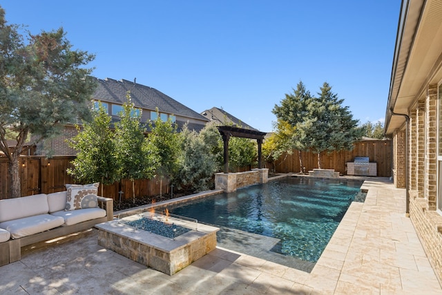 view of swimming pool with a patio area, a fenced in pool, a fire pit, and a fenced backyard