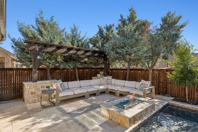 view of patio / terrace with an outdoor living space with a fire pit, a fenced backyard, and a pergola