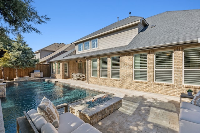 view of swimming pool with a patio, fence, a fenced in pool, and ceiling fan