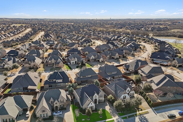 aerial view with a residential view and a water view