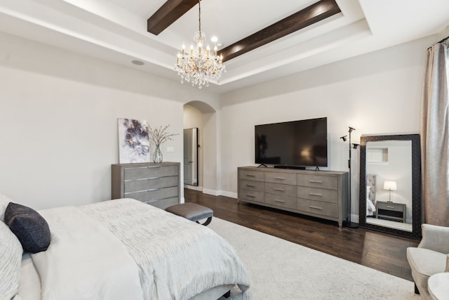 bedroom featuring dark wood-style floors, arched walkways, a raised ceiling, and beamed ceiling