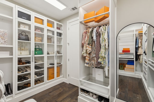 walk in closet featuring dark wood-style floors and visible vents