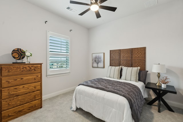 bedroom with light carpet, baseboards, and visible vents