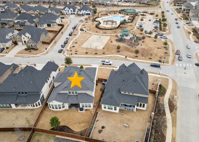 birds eye view of property with a residential view