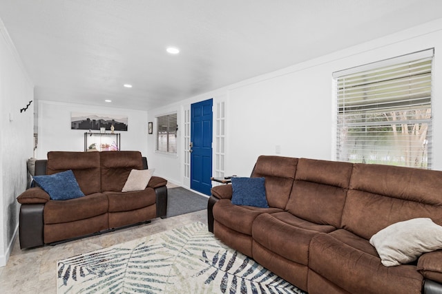 living room featuring baseboards and recessed lighting