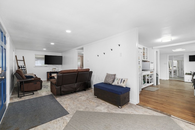 living area with recessed lighting, crown molding, baseboards, and wood finished floors