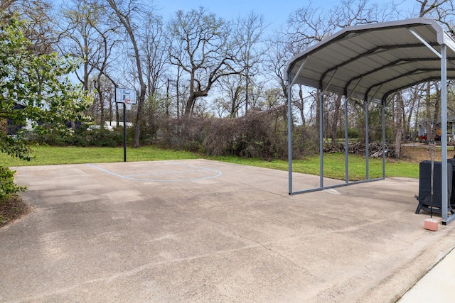 view of sport court with basketball court and a yard