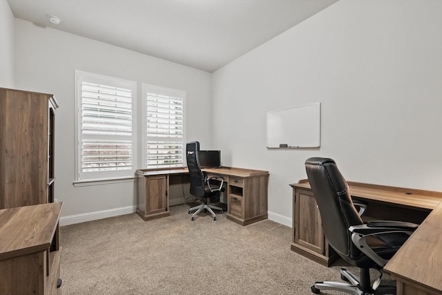 office space with baseboards and carpet flooring