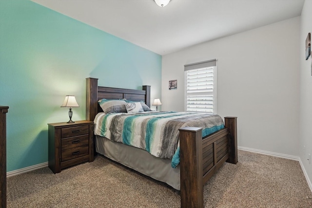 bedroom featuring carpet flooring and baseboards