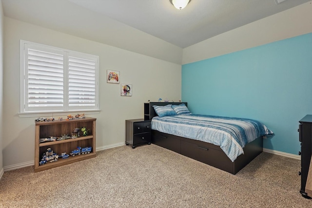 carpeted bedroom featuring baseboards