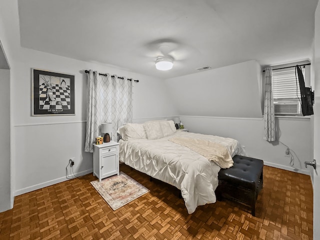 bedroom featuring baseboards, visible vents, and ceiling fan