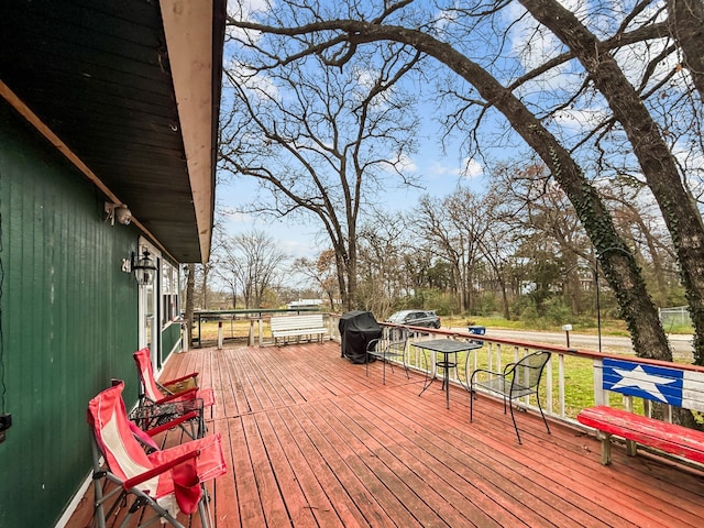 wooden deck featuring area for grilling