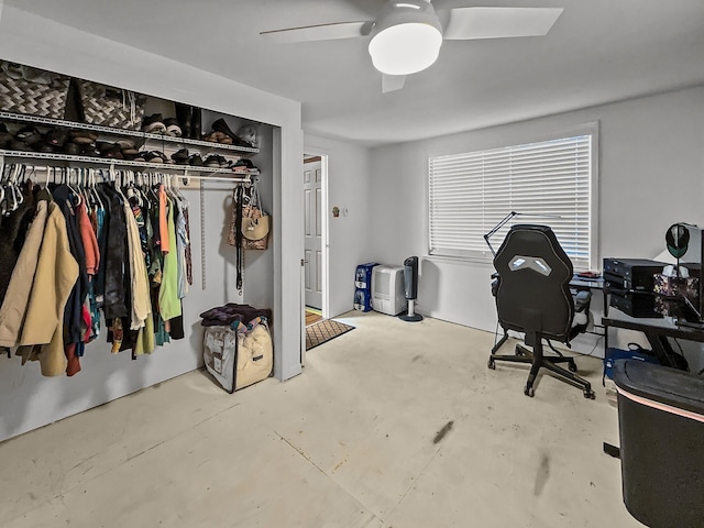 office space with ceiling fan and unfinished concrete floors