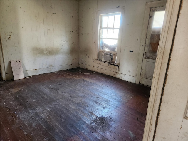 unfurnished room with wood-type flooring and cooling unit