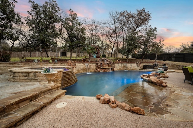 pool at dusk with a fenced in pool, a patio area, and fence