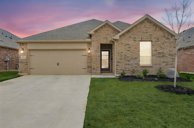 single story home featuring an attached garage, a shingled roof, concrete driveway, and brick siding