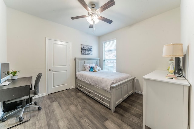 bedroom featuring dark wood-style floors, baseboards, and a ceiling fan