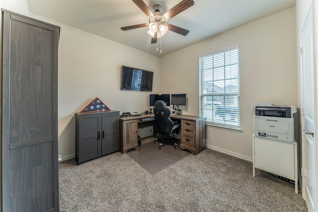 office with a ceiling fan, baseboards, and carpet flooring