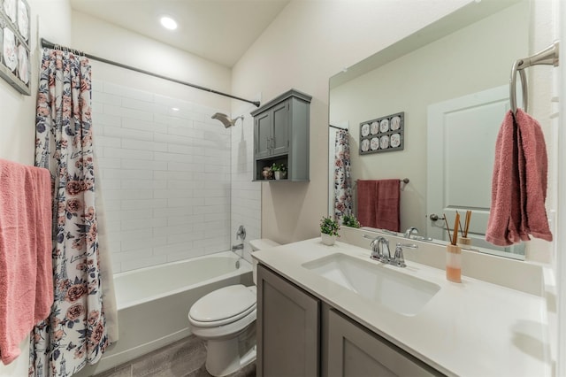 full bath with shower / bath combination with curtain, vanity, and toilet