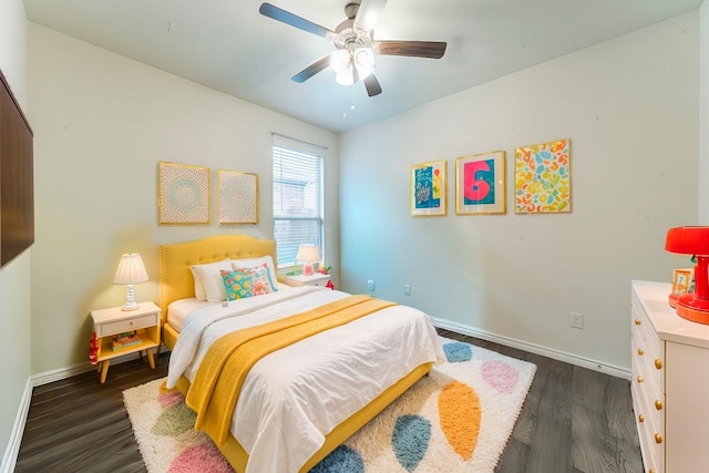 bedroom with ceiling fan, baseboards, and dark wood-style flooring