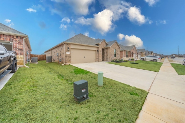 view of front of property featuring brick siding, concrete driveway, an attached garage, a front yard, and fence