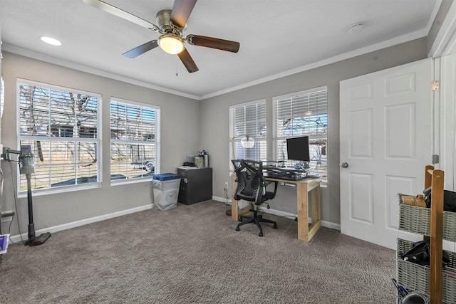 office space with carpet floors, ornamental molding, a ceiling fan, and baseboards