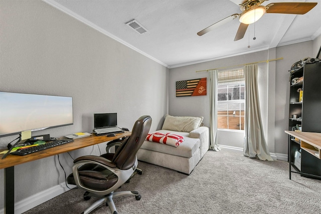 office with ornamental molding, carpet, visible vents, and baseboards