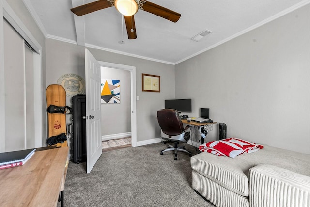 carpeted office space with a ceiling fan, baseboards, visible vents, and crown molding