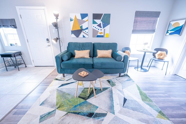 living room featuring baseboards and wood finished floors