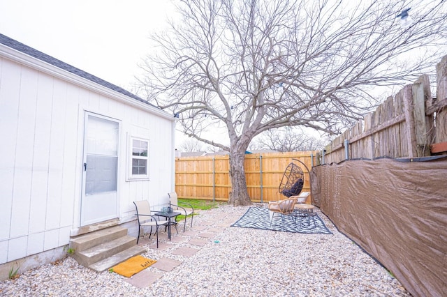 view of patio with entry steps and a fenced backyard