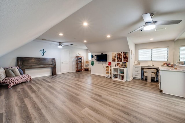 interior space with recessed lighting, lofted ceiling, and light wood-style flooring