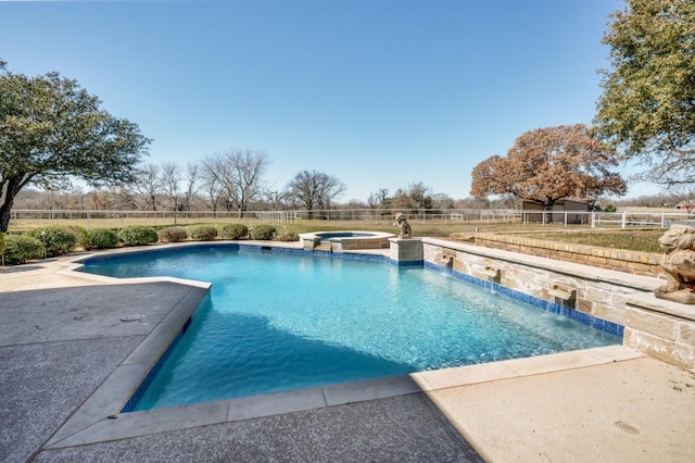 view of swimming pool with a patio, a pool with connected hot tub, and a fenced backyard