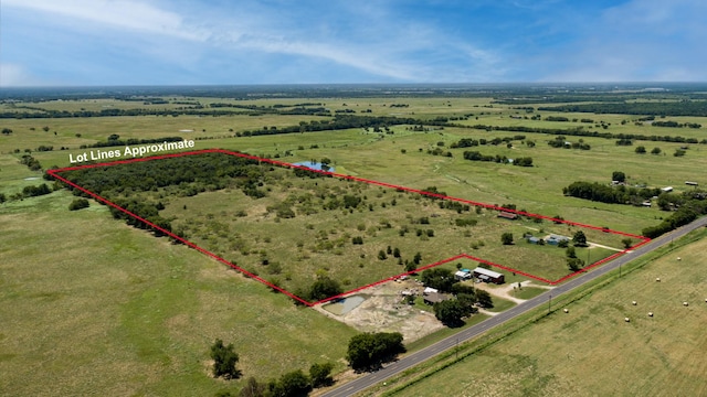 birds eye view of property featuring a rural view