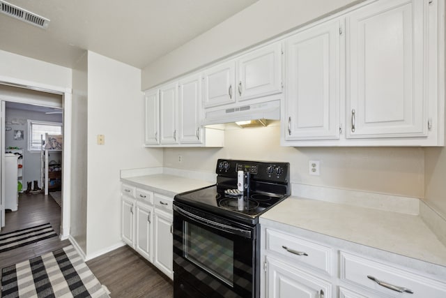 kitchen with light countertops, electric range, visible vents, and under cabinet range hood