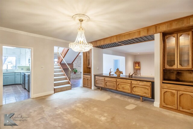 dining room featuring crown molding, light colored carpet, an inviting chandelier, baseboards, and stairs