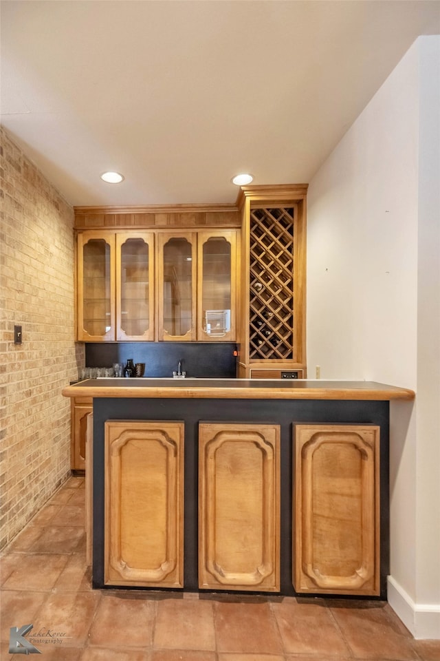 bar with brick wall, bar, and recessed lighting