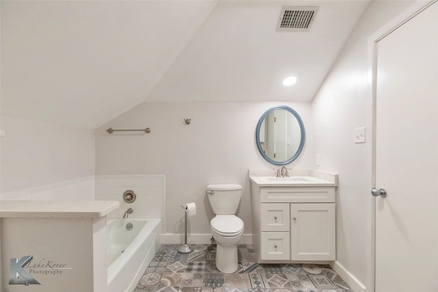 bathroom featuring a garden tub, lofted ceiling, visible vents, toilet, and vanity