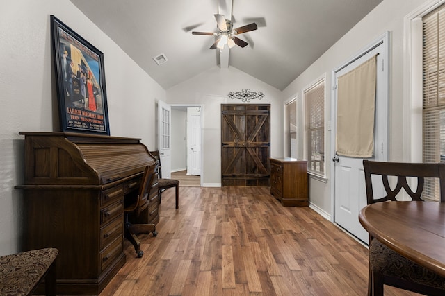 entrance foyer featuring vaulted ceiling, wood finished floors, visible vents, and baseboards