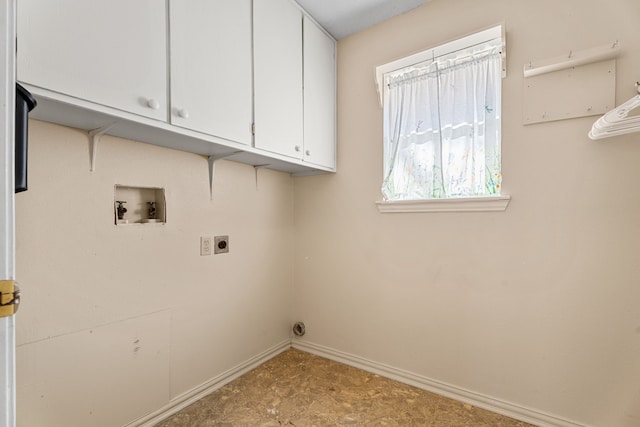 laundry area with hookup for a washing machine, cabinet space, electric dryer hookup, and baseboards