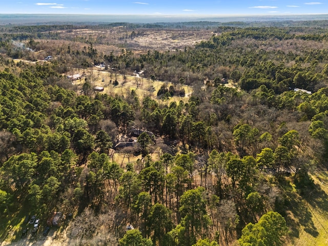 bird's eye view featuring a wooded view