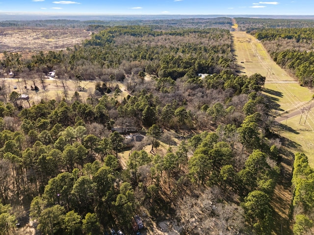 drone / aerial view with a rural view and a wooded view