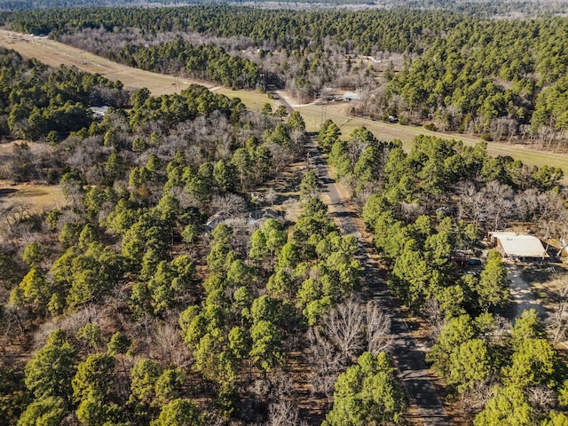 aerial view featuring a view of trees