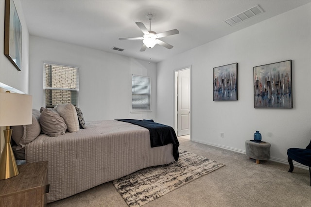 bedroom featuring carpet floors, ceiling fan, visible vents, and baseboards