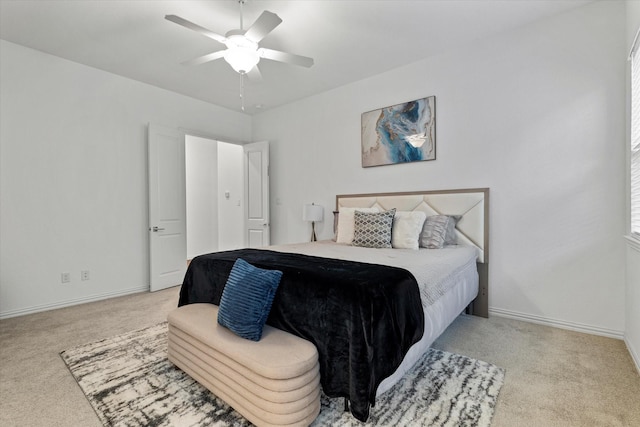 bedroom with carpet floors, ceiling fan, and baseboards