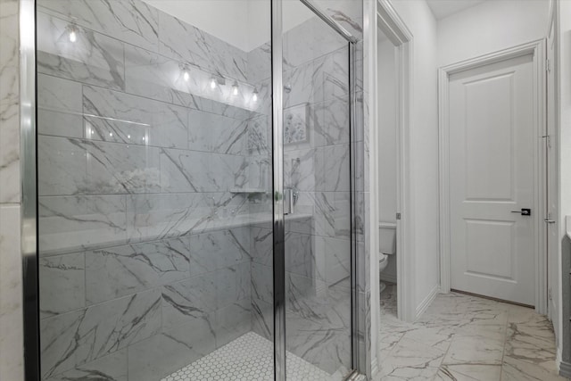 full bathroom featuring marble finish floor, toilet, and a marble finish shower