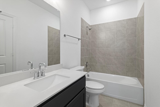 full bathroom featuring toilet, tile patterned flooring, vanity, and bathing tub / shower combination