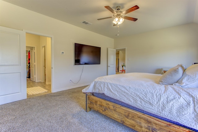 bedroom with baseboards, visible vents, lofted ceiling, ceiling fan, and carpet flooring