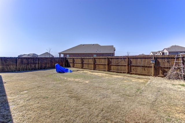 view of yard featuring a fenced backyard