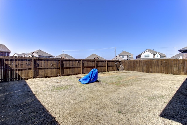 view of yard featuring a fenced backyard