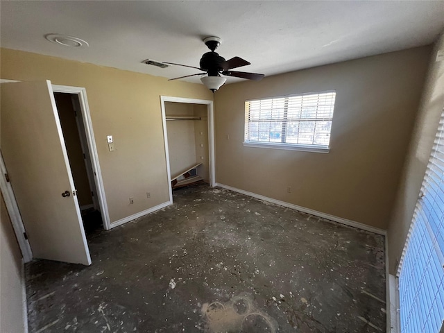unfurnished bedroom with a closet, visible vents, ceiling fan, and baseboards